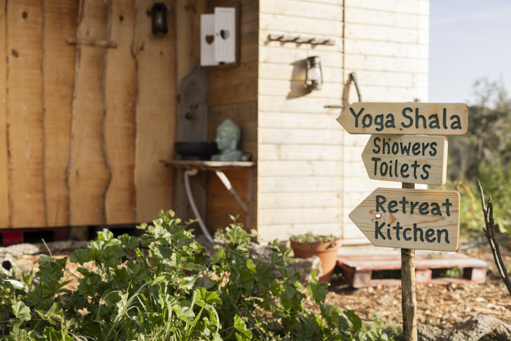 Hand-painted signs on the paths at Pachawa
